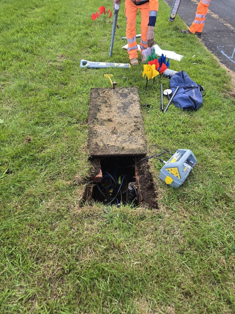 Tracing a clamped communications cable away from the access chamber